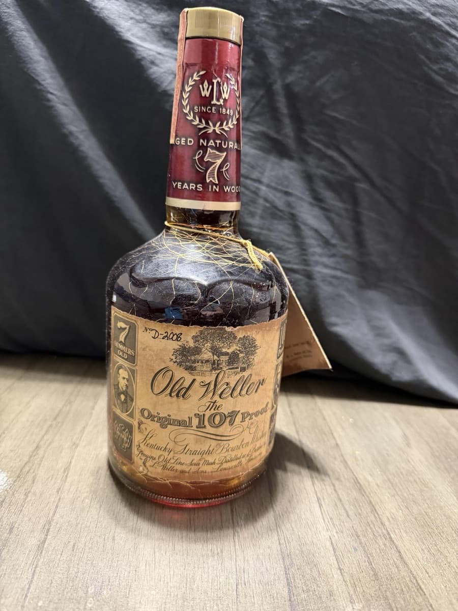 A dusty Old Weller Original 107 on our intake table, tagged for verification